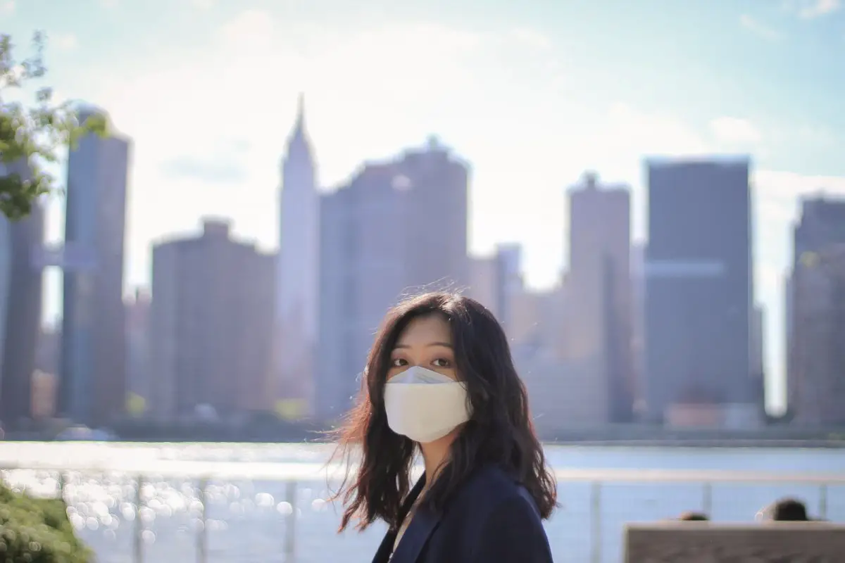 woman in black jacket wearing white sunglasses