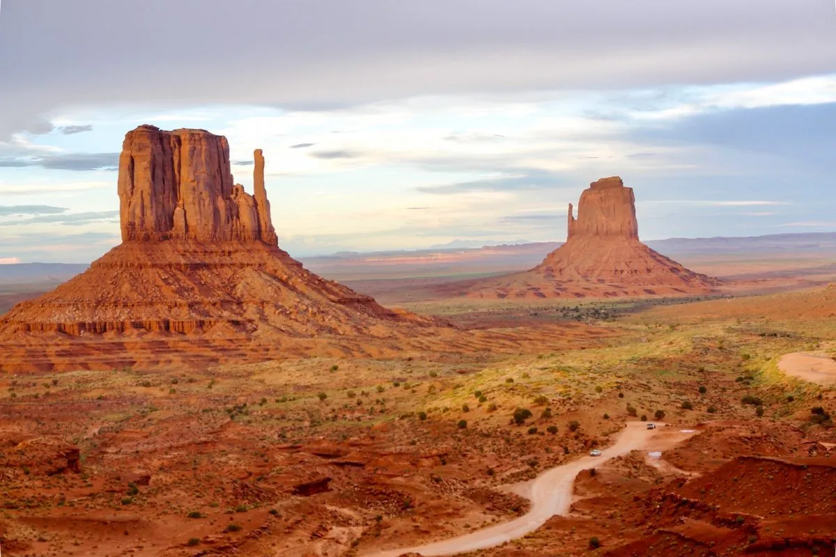 brown rock formation under white clouds during daytime